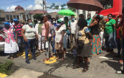 APNU+AFC supporters flout Covid-19 restrictions to cheer Lowenfield at court