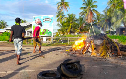 Worker takes over driver’s seat of vehicle to save boss from violent protesters