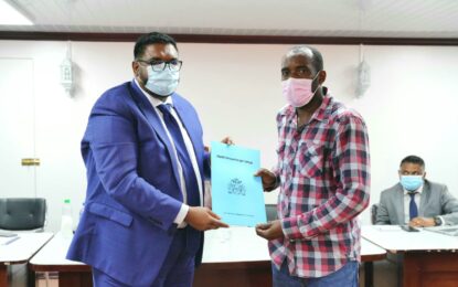 Three E’bo Coast residents receive titles after waiting for years