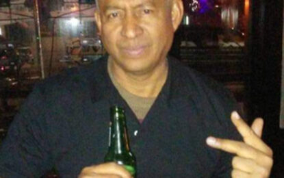 One killed, another injured after truck crashes into parked pick-ups