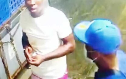Bandits caught sharing loot under camera