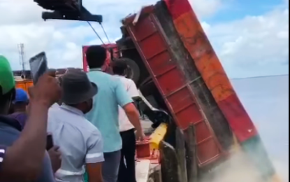 Driver drowns after truck topples over John Fernandes wharf