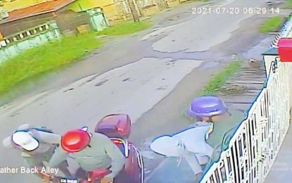 Men robbed while opening gate
