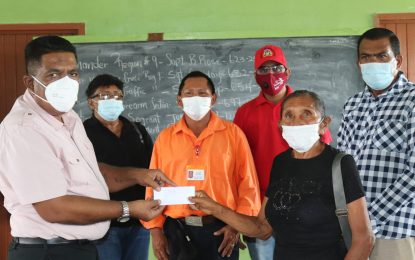 Govt. Ministers take flood-relief grant to Region Nine