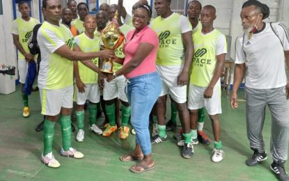Guyana Masters Football Team claims Modern Optical Trophy