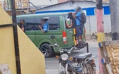 Driver who had child clinging on from the back of his bus charged