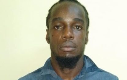 Vendor remanded for possession of firearm, ammo, drugs