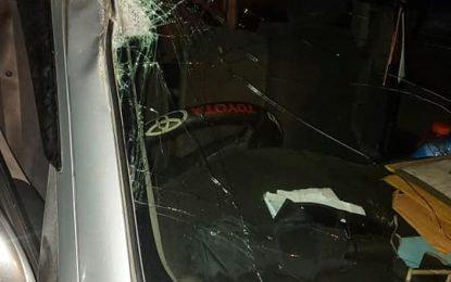 Passengers escape unhurt after log slips from truck onto minibus