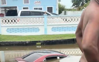 Car lands in trench after crashing into another vehicle