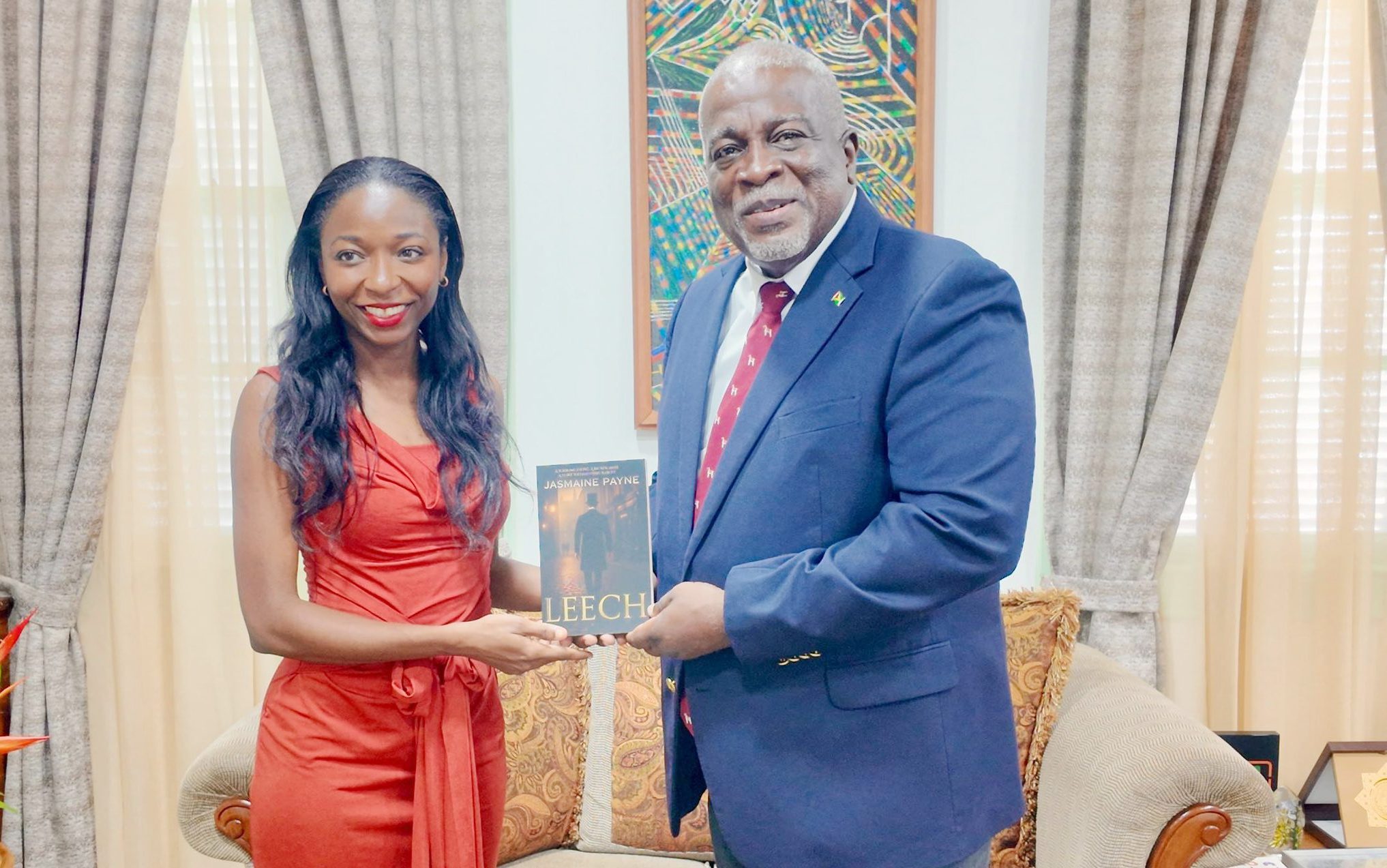 Guyanese writer Jasmaine Payne presents book to PM Phillips