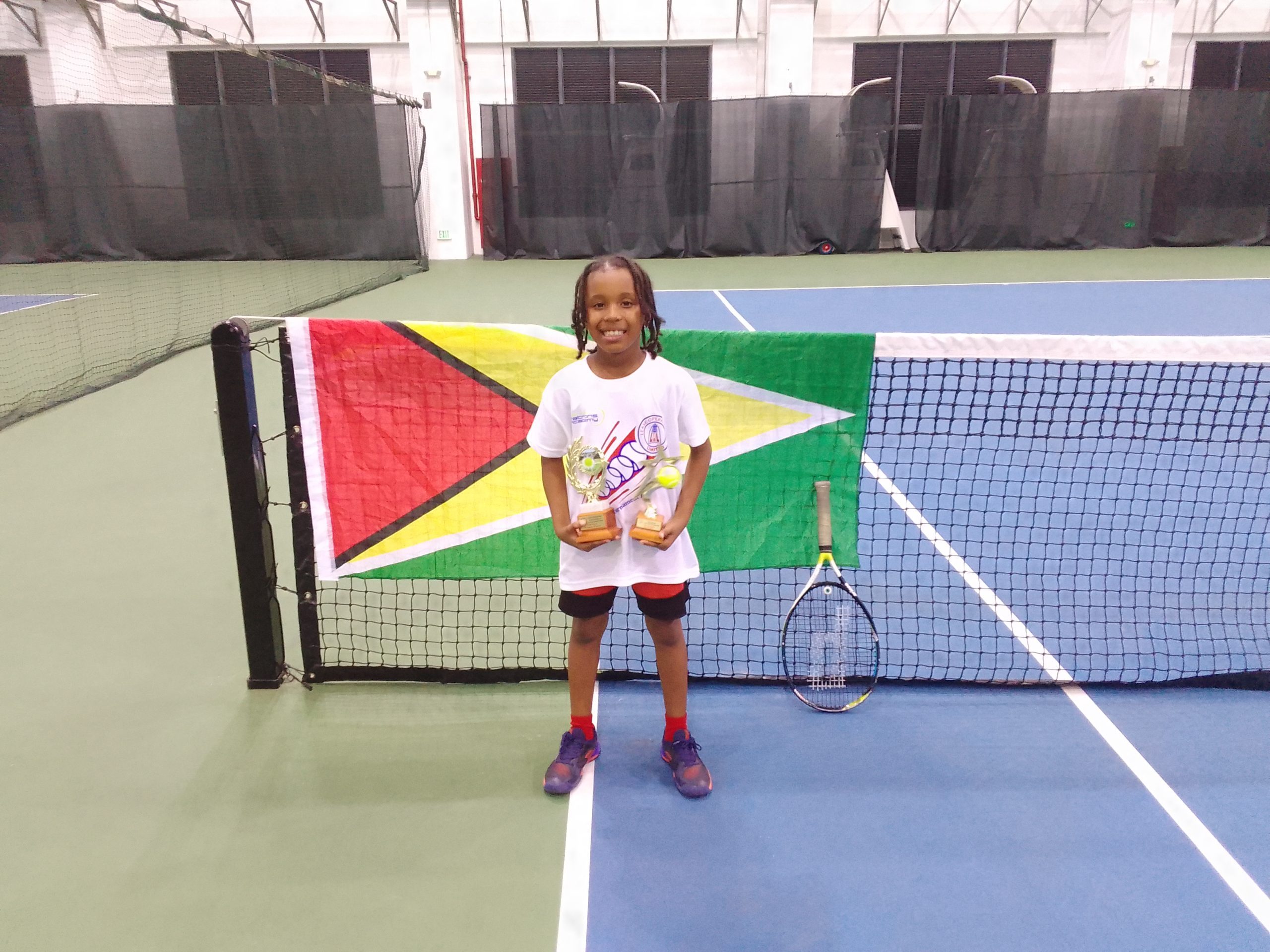 Zion Hickerson captures U12 & 14 Tennis Titles