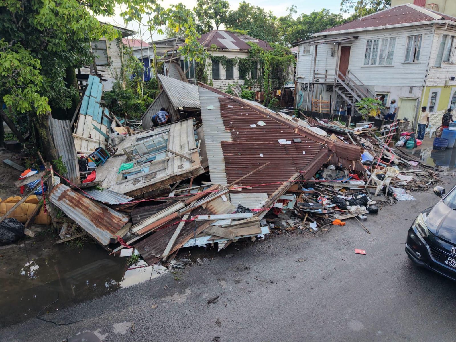 Two-storey house collapses on cemetery road; occupants escape unhurt