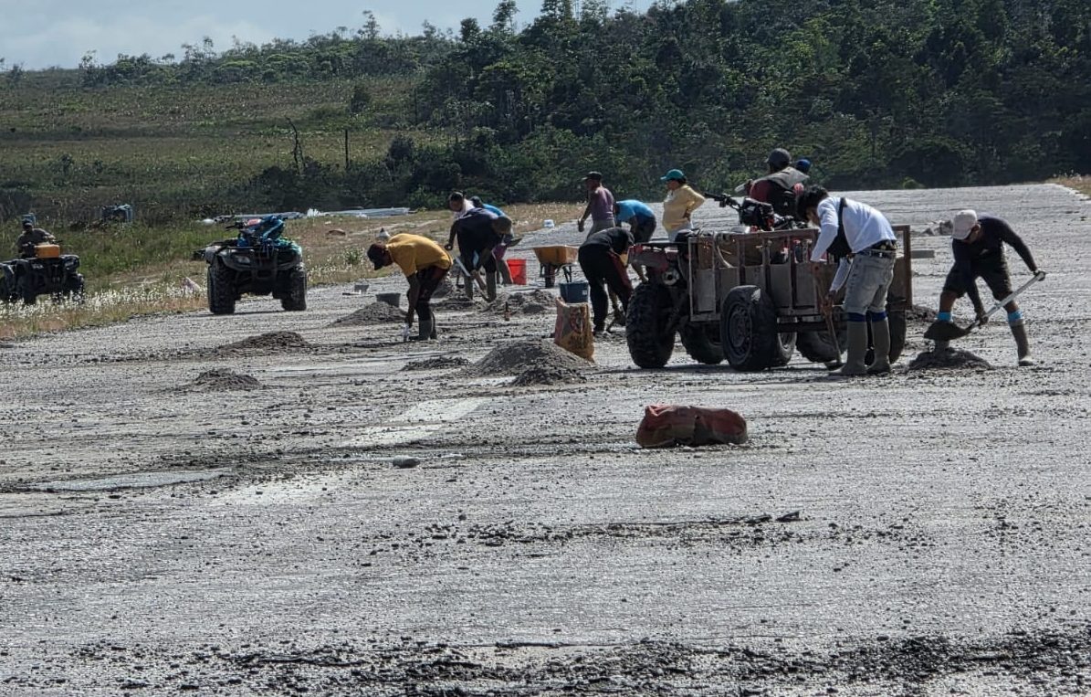 Chi Chi West residents patch potholes on airstrip to aid safe landing of planes