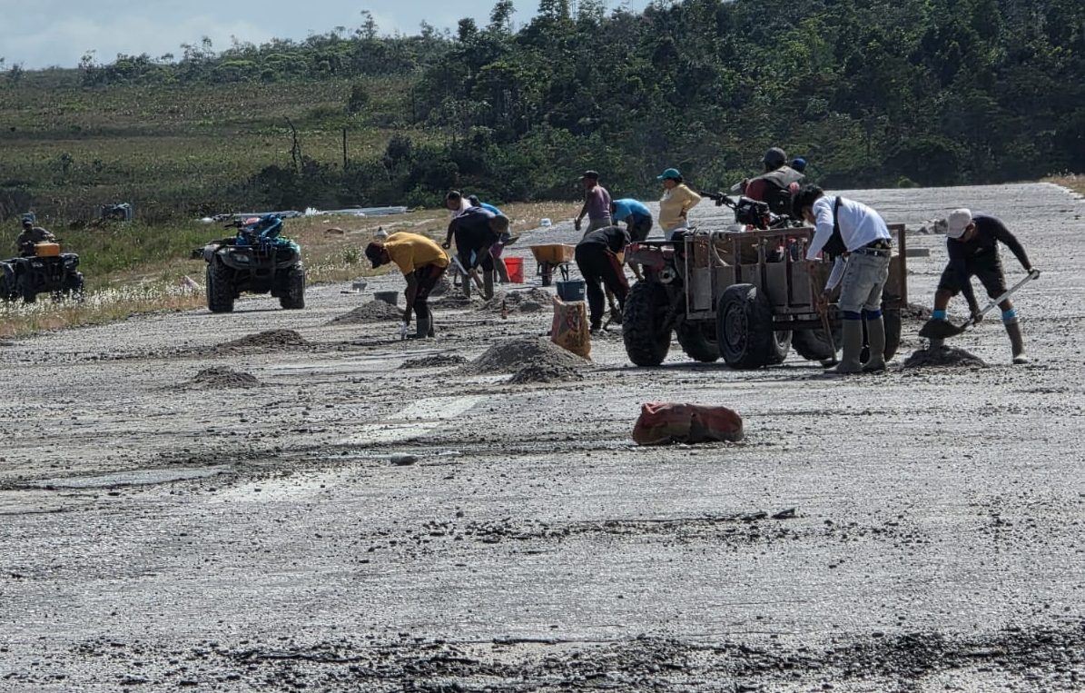 Chi Chi West residents patch potholes on airstrip to aid safe landing of planes