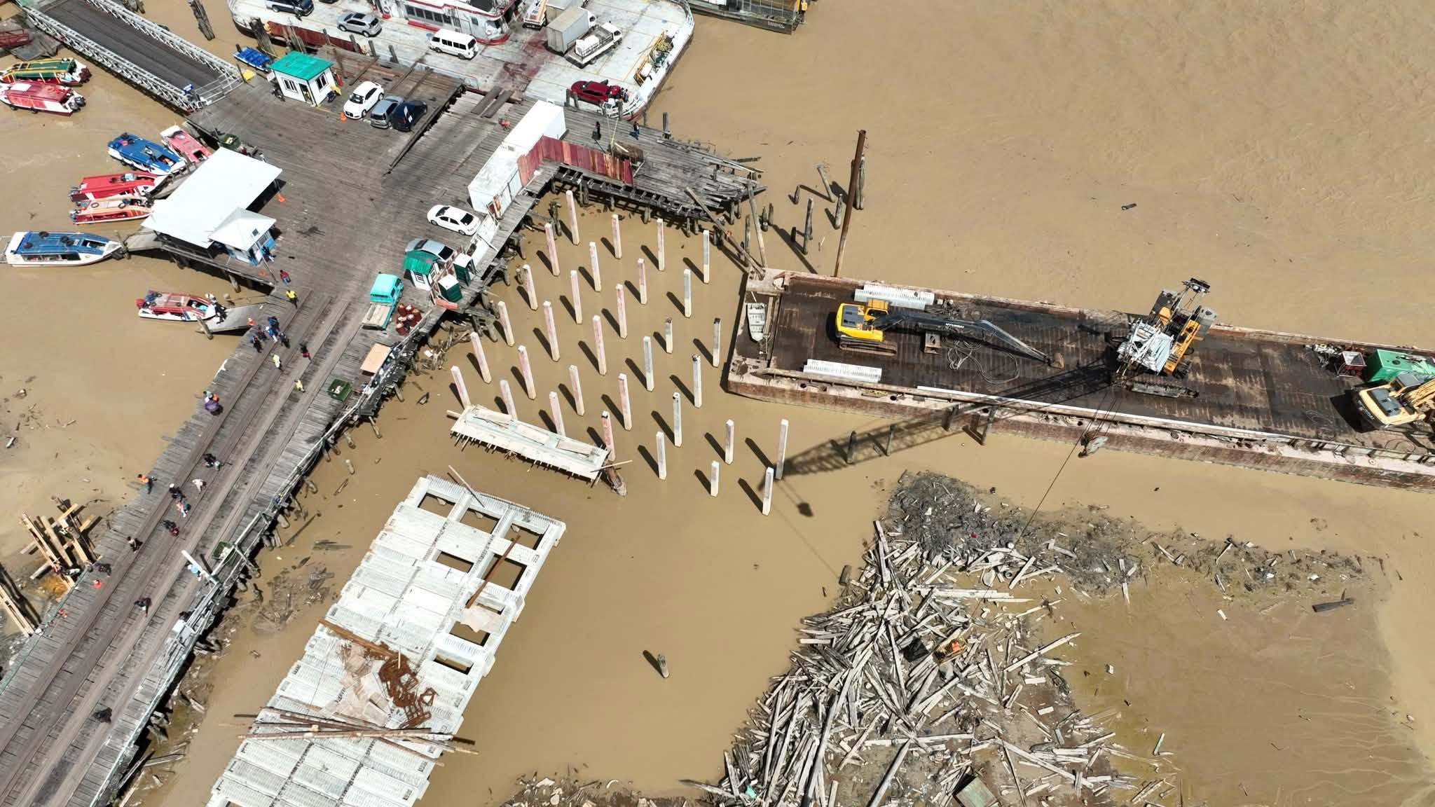 Temporary timber jetty being constructed at Parika Stelling for heavier trucks