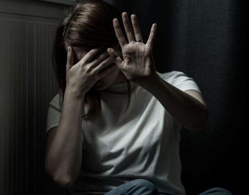 Woman struck to head with axe by husband  